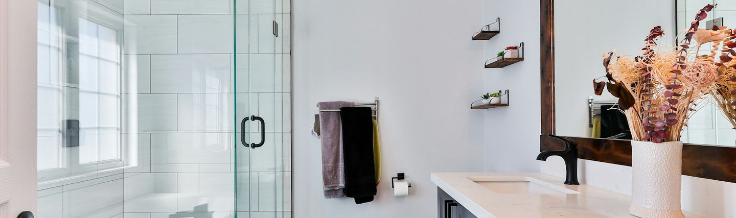Modern renovated bathroom with a walk-in shower and double washbasin